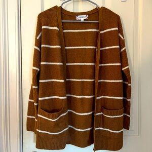 a warm yellowish brown and white striped cardigan. size s/m.